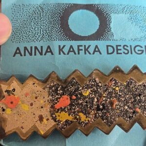 Anna Kafka Designs hair clip with original packaging.